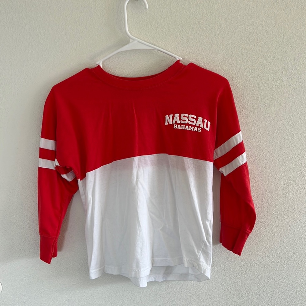 pink and white bahamas shirt, it looks red in the pictures but it’s pink almost